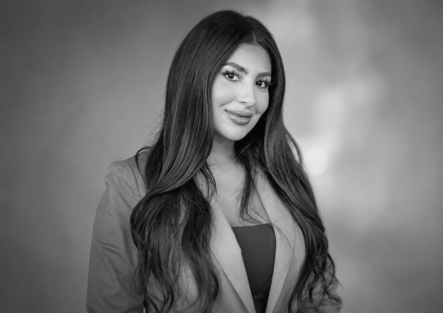 Woman in blazer portrait.